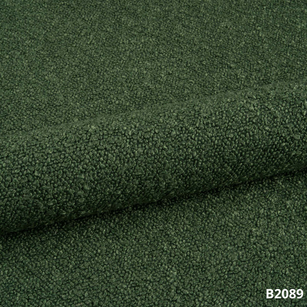 Dunkelgrüner Bouclé-Bezug der Premium-Massageliege ELEMENT, hochwertige Polsterung.