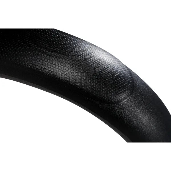 Schwarze, texturierte Armlehne eines Fußpflegestuhls.