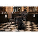 Volt Braun barber chair with electric height adjustment, foldable footrest, in a modern barbershop.
