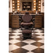 VOLT brown barber chair with electric height adjustment, footrest, and foldable design for premium barbershop comfort.