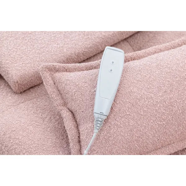 Weiße Fernbedienung der Premium Elektrischen Massageliege ELEMENT auf rosa Frottee-Decke.