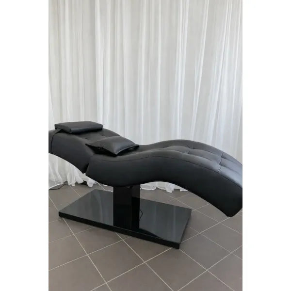 Schwarze Premium-Massageliege mit 1 Motor, kurvenförmiges Design und gepolsterten Kopfkissen
