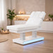 Elektrische Kosmetikliege MUSE+ Spa-Liege mit Heizung, LED-Beleuchtung und 4 Motoren in moderner Spa-Atmosphäre.
