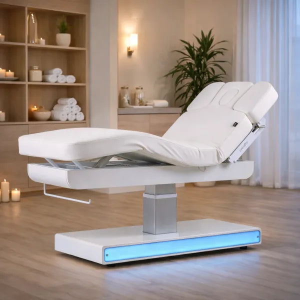 Elektrische Massageliege NUSH+ mit drei Motoren, weiße Premium Spa- und Kosmetikliege im Behandlungsraum