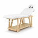Holz-Massageliege mit 2-Zonen Polsterung und weißen Kopfteil für Spa & Kosmetik. Robustes Naturdesign mit Ablagefach.