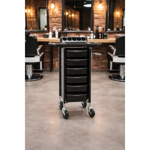 Friseur Arbeitswagen Keep in Schwarz mit 6 Schubladen, Metallrahmen und leichten Rollen für einfache Mobilität.