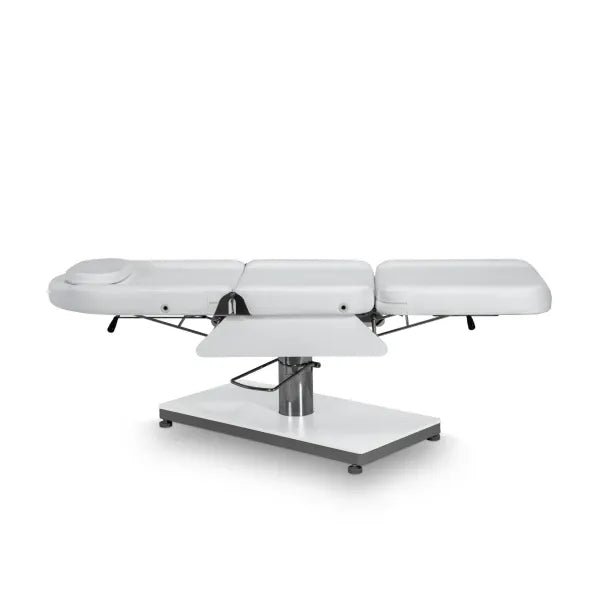 Hydraulische Kosmetikliege mit verstellbarer Rückenlehne und Fußteil, weiße PU-Bezüge, abnehmbares Kopfpolster.