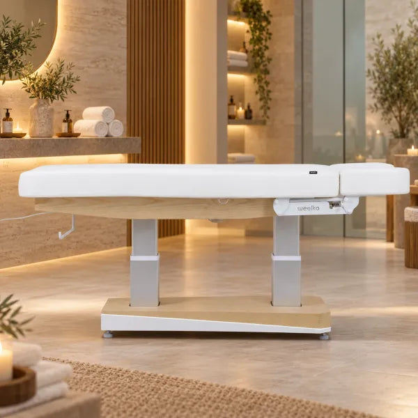 Elektrische Spa-Kosmetikliege mit Holzoptik, weißem Polster und 4 Motoren für Wellness & Kosmetikstudio.