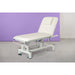 Electric massage table with one motor, height-adjustable treatment bed on wheels, white upholstery.