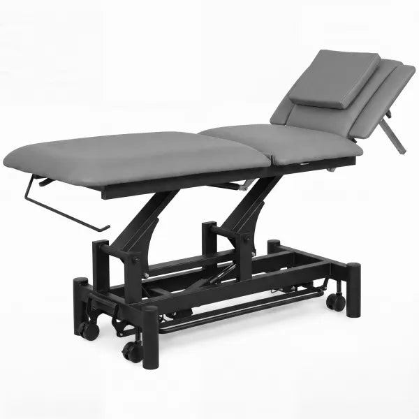 Elektrische Behandlungsliege mit 1 Motor, graues Polster und schwenkbarer Kopfstütze sowie stabilem Gestell mit Rollen für Kosmetik und Massage.
