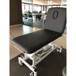 Therapieliege PRO 201 electric treatment table, gray, two-part top with backrest, height adjustable.