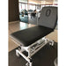 Therapieliege PRO 201 electric treatment table, gray, two-part top with backrest, height adjustable.