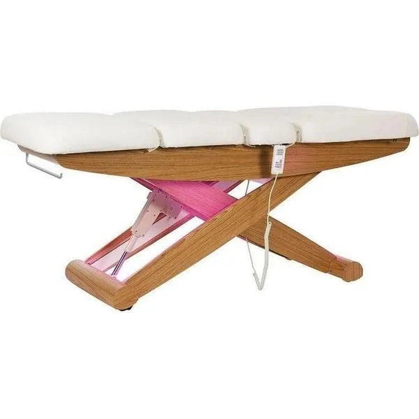 Massageliege aus Holzgestell mit weißen PU-Polstern, X-Beinen und pinken Stützstreben