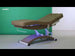 Beheizbare Massageliege: Bedienfeld mit LED-Display (60°C) und beleuchteten Knöpfen am braunen Bezug.