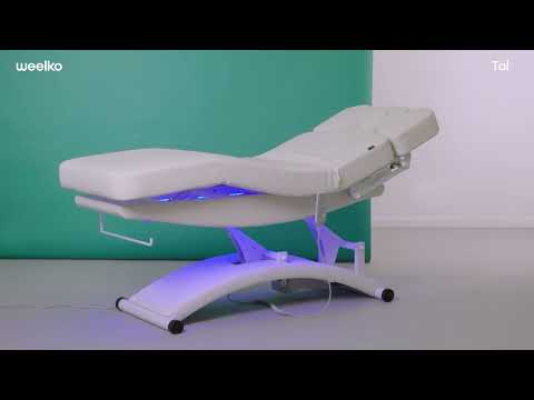 Beheizbare Massageliege: Bedienfeld mit LED-Display (60°C) und beleuchteten Knöpfen am braunen Bezug.