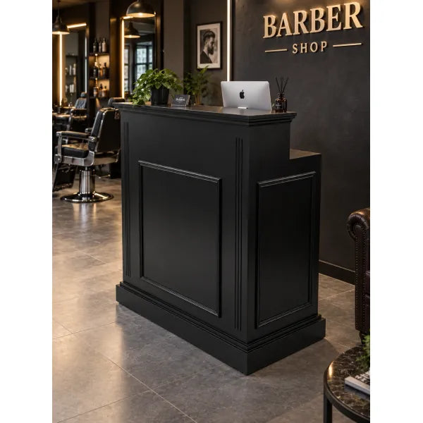ACE Friseur-Rezeption mit Stauraum im Barbershop; eleganter Empfangstresen mit Laptop und Pflanze.