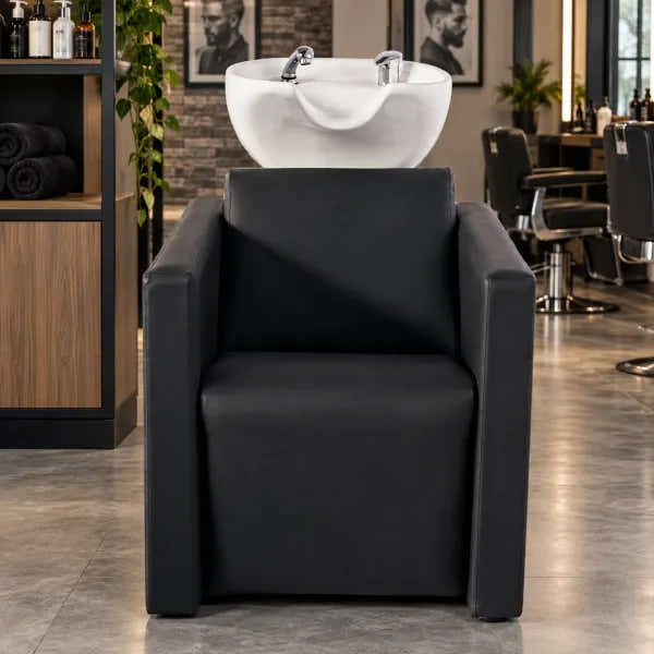 Schwarzes Friseurwaschbecken mit elektrischer Fußstütze & Massagefunktion für professionelle Salons.