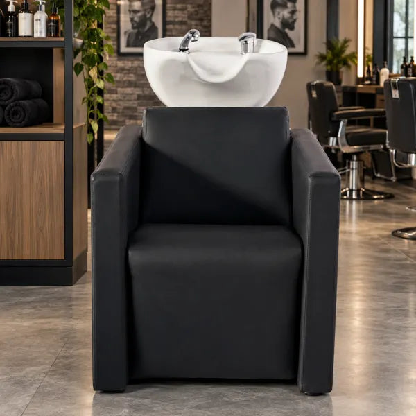 Schwarzes Friseurwaschbecken mit elektrischer Fußstütze & Massagefunktion für professionelle Salons.