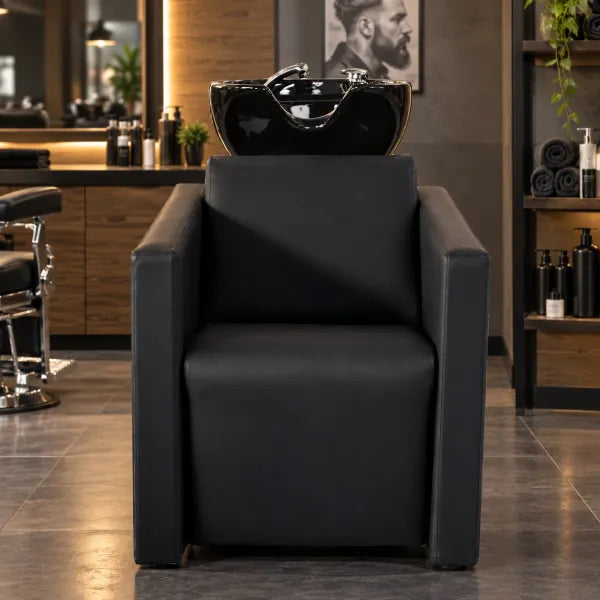 Schwarzes Friseurwaschbecken mit elektrischer Fußstütze & Massagefunktion für professionelle Salons.